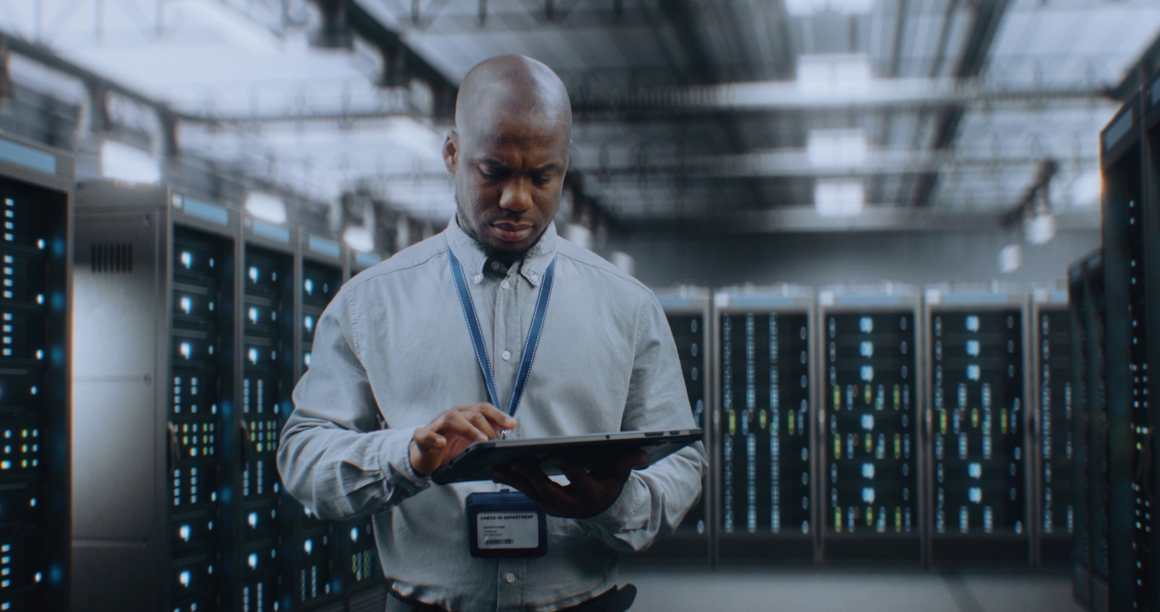IT specialist using a tablet in a data center