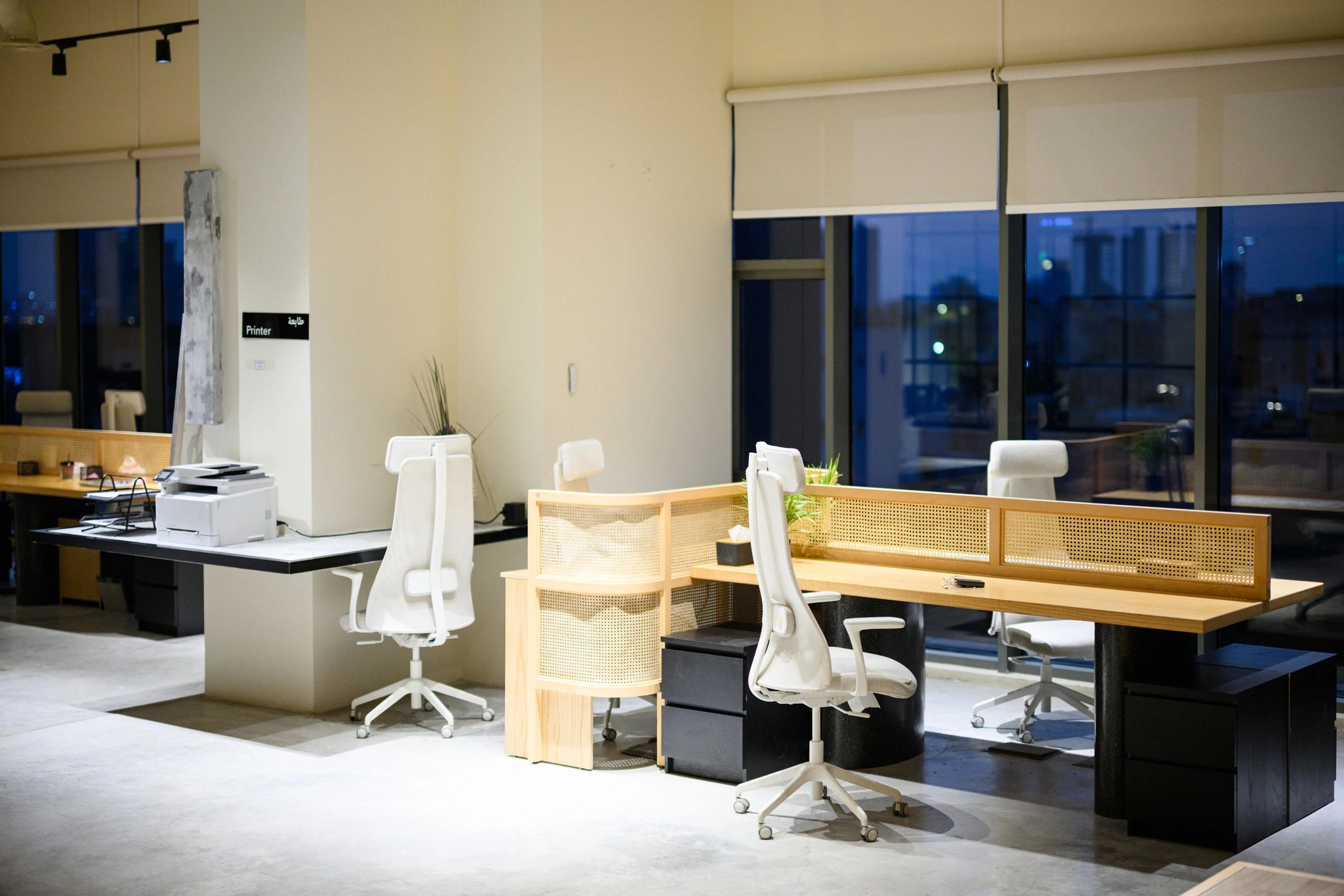 Modern office workspace with desks and chairs